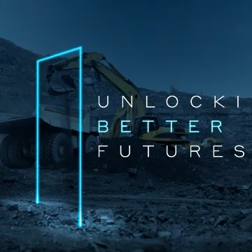 A mining truck at night framed by a neon rectangle, captioned “Unlocking better futures”