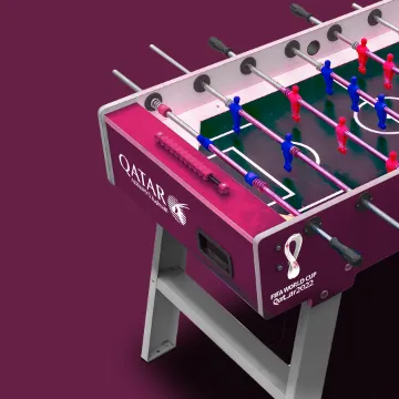 A foosball table branded for the Qatar 2022 World Cup